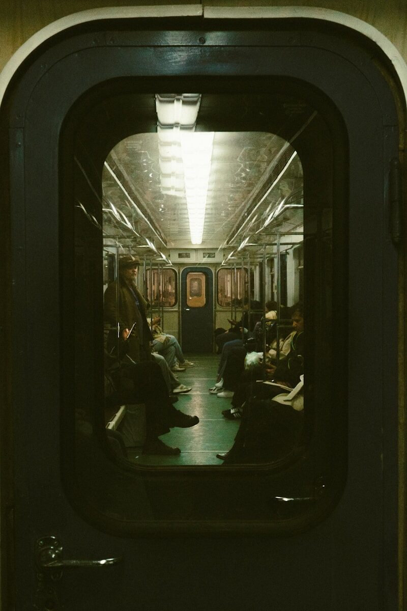 People sitting inside a subway car